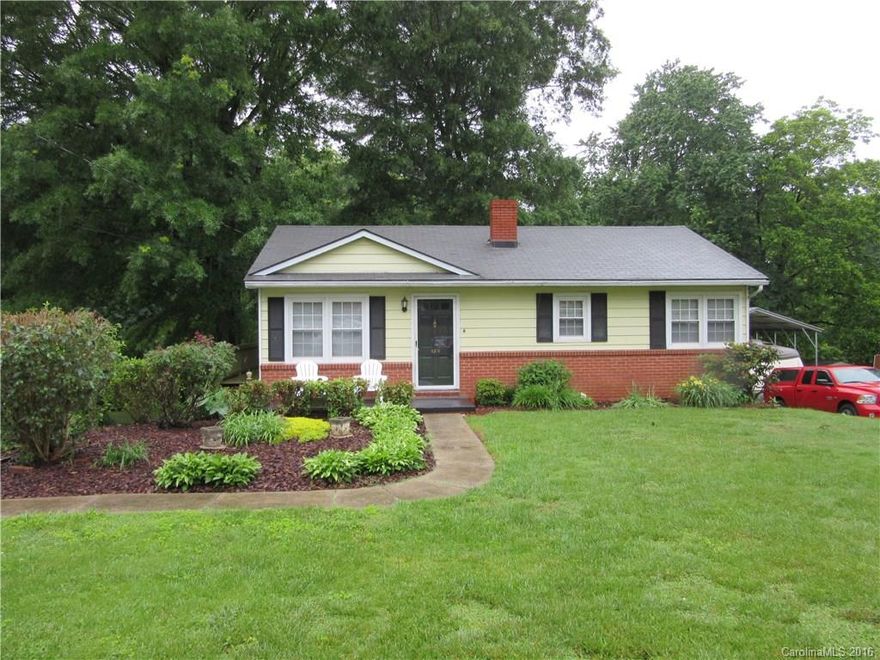 This home has been recently painted inside, has replacement windows, new laminate flooring. kitchen has been updated, really cute home, has lovely front yard, full basement with garage door, wrap around decking for easy access to back yard, deep lot