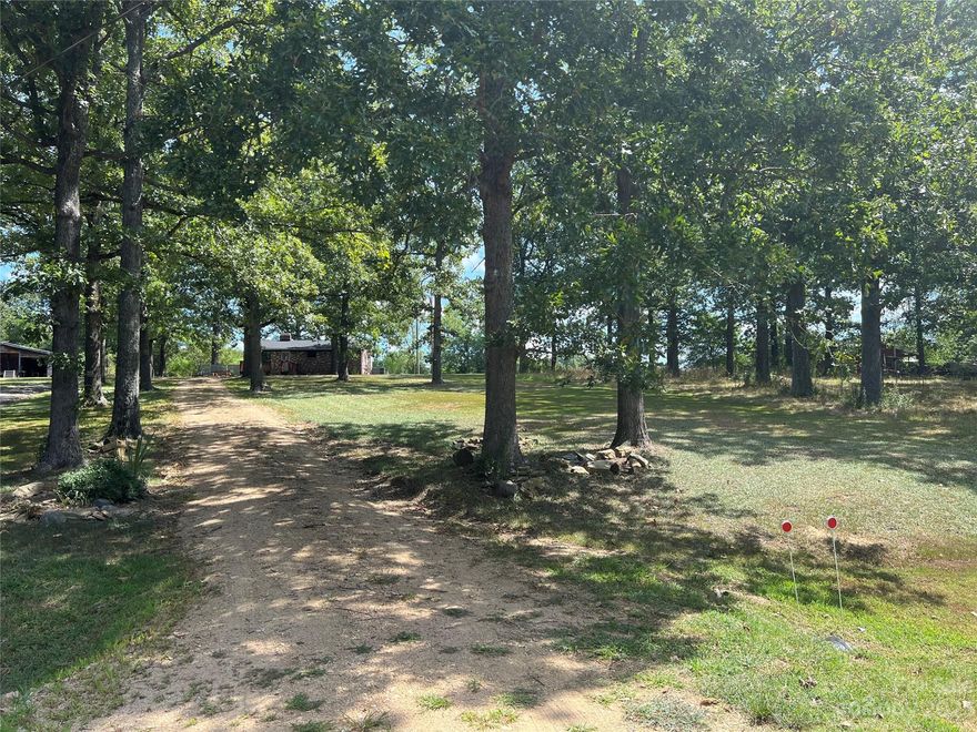 Idyllic country setting for this charming all brick bungalow located on 1.23 acres in the popular Buford school district. If you're looking for tranquility, privacy & a starter home or an investment property, you have found it! The sellers did some renovations & lived in this home while they built their other home. As a starter home, it's a great opportunity to continue the updates and make it your own. Or turn it into your dream home, whether it be a barndominium, a farmhouse or a country cottage; the possibilities are endless with this beautiful property. Some interesting history includes the original windows from the first Lancaster high school as well as the exterior brick. The open floorplan allows a spacious living, dining and kitchen area. The home is being sold AS IS. New roof and water heater in 2017 as well as the bathroom & kitchen renovations. Some windows have cracks. Seller has stated that the home is very energy efficient keeping warm in winter & cool in summer.