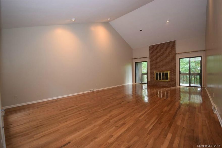 Amazing space & location in this Carmel South condo! Minutes to Ballantyne, South Park, 485 & much more! New carpet in bedrooms and basement, new tile floor in kitchen & foyer, new granite c-tops in kitchen,new paint throughout! Enjoy entertaining? This home is an entertainer's dream, with a large great room on the main level and a huge den in the basement, both w/ fireplaces! Master on main with balcony access overlooking the tranquil green space. Large courtyard off the back as well as entry!