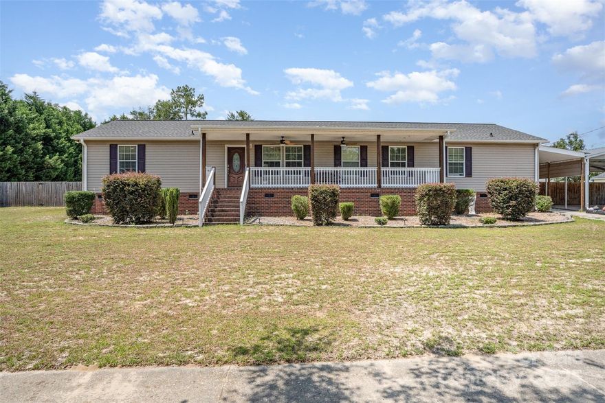 Motivated sellers! Charming and functional, this home sits on a spacious 0.69 acre fully fenced lot. Offering privacy, room to roam, and plenty of outdoor enjoyment. Inside, you'll find two generous living areas and a split-bedroom floor plan for ideal flow and functionality. Start your mornings on the covered front porch, enjoy the garden, and entertain with ease on the freshly painted back deck. The primary suite and home office are thoughtfully positioned opposite of the three secondary bedrooms for added privacy. Located in the heart of Kershaw, this property blends comfort, convenience and charm.