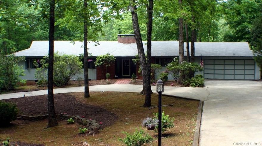 BACK ON THE MARKET Awesome custom built home on large, naturally landscaped wooded corner lot. Quiet neighborhood with winding roads, 28x17 great room with full-height brick fireplace, cathedral, wood beam ceilings. Large dining room with huge skylight, large bdrms with walk-in closets, heated all-season sunroom w view of the pond and woods. In-ground pool with gazebo. 2½ car garage w workbench & storage and workshop in basement. Circular driveway with custom stonework & pad for extra parking.