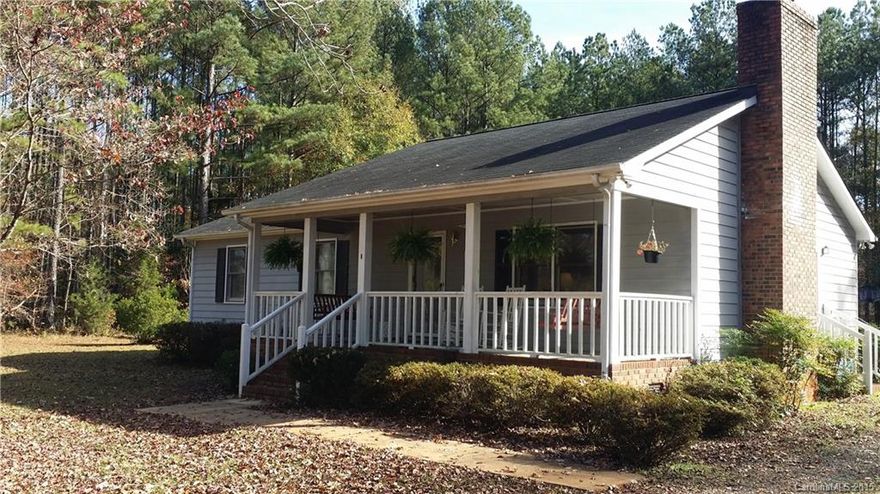 Look NO further! This one has it all! Country area with a sweet private country feel, tree lined level yard, 1.72 acres and the sweetest gathering front porch with two swings for crisp mornings with a tall cuppa Joe or sunny afternoons where friends and neighbors gather for a visit! Three bedrooms, two full baths a large eat in kitchen with tons of cabinets! Room for tons of parking! A wood burning fireplace for chilly winter evenings, a deck out back and a separate detached WORKSHOP/garage.