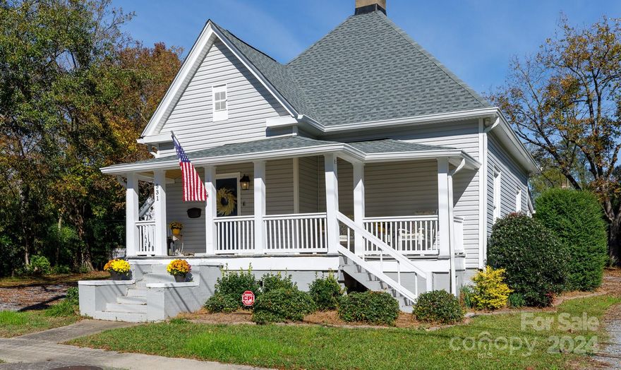 Step into a piece of history with this beautifully updated home built in 1900! You'll step into a quaint entryway currently being used as a music room and see loft ceilings, oversized trim, and original hardwoods. You can cook dinner in an updated kitchen with butcher block counter tops (2017), newer appliances and deep farmhouse sink. This 3 bedroom home features 2 full bathrooms- one complete with a claw foot tub, newer plumbing (2017 and 2024), newer electrical (2017 and 2024), tankless water heater (2023), new roof (2024), new sump pump and vapor barrier (2024) and an updated rear deck (2017). A full list of updates is available upon request. Third bedroom is currently being used as a den. Multiple fire places in home are sold as is. Most windows are original and ALL windows are as is. Property being sold together with 535 E. Black St TMS 627-07-03-016 for a combined acreage of .29ac.