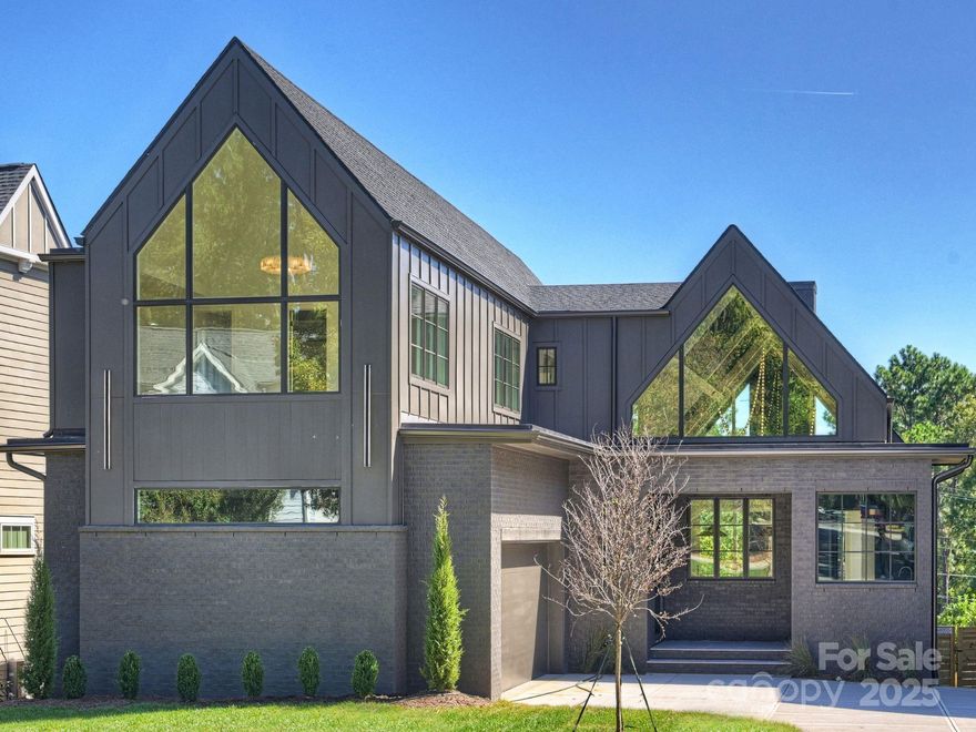 One of a kind, exquisite new construction by Royal Building in sought-after Chantilly. Situated on a premium lot that backs directly onto a serene park, this home offers unmatched privacy & views. Every detail thoughtfully curated by renowned interior designer, ensuring a cohesive, elevated look. Expansive windows, 10ft doors & vaulted 26' foot soaring ceilings flood the open-concept living areas w/natural light while highlighting flawless craftsmanship. Gourmet kitchen is a culinary masterpiece featuring top-of-the-line appliances, custom cabinetry & scullery. Lavish Primary suite is a sanctuary w/spa-inspired bathroom. Second level boasts 3BRS w/ensuite baths PLUS fully finished walkout Basement offering secondary living quarters w/kitchen, guest suite & options for theater, exercise room (see remarks). Seamless indoor-outdoor living flows onto the TWO covered terraces each w/fireplaces & views of the park. Rare opportunity of luxury, location & nature right next to the park.