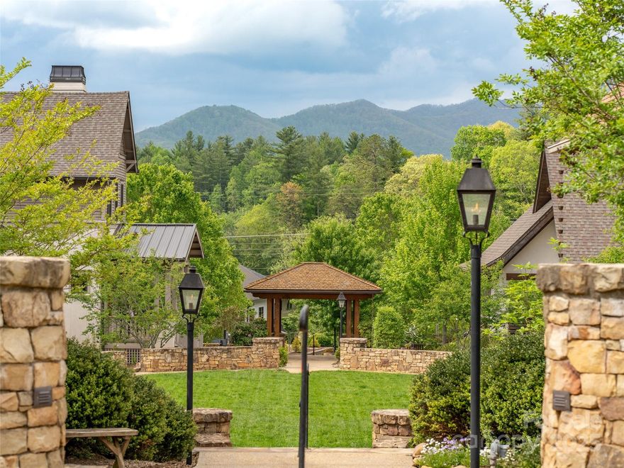 LAST CHANCE TO BUILD YOUR DREAM HOME "ON THE GREEN" with the LAST BUILDABLE LOT left in the Jacob's Cottages section of the Village of Cheshire. This flat lot comes with 4000+sf home plans already approved to be built on this lot. Stroll right down to the Recreation and Fitness Center w/pool, walk to the pickle-ball and tennis courts or head on over to Cheshire Village where you will find a mix of dining and retail businesses, such as The Artisan Gourmet Market, a gourmet market and sandwich shop with a coffee and wine bar; Sake Sushi and The Cheshire Arms, a British pub-style restaurant. You will even find a salon and a medical complex. The gas lamps flickering are a beautiful touch as the sun begins to set against the back drop of the Great Craggy Mountains. The community of Jacob's Cottages also boasts a dog park and a community garden, as well as being just a short drive to downtown Black Mountain! BE SURE TO ASK FOR OUR PROPERTY VIDEO.