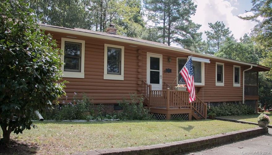 20.8 Acres w/beautiful energy efficient custom log home.  Home is well built and economically efficient.  It has a wood burning fireplace insert w/blower that will heat entire house.  3BR, 2BA, Island kitchen, and  immense great room,.  Country living at its best w/look and feel of a mountain retreat.  Wrap around deck and screen porch.  In-ground pool w/pool house, wired 20 x 30 storage bldg.  1 Year Home Warranty provided.