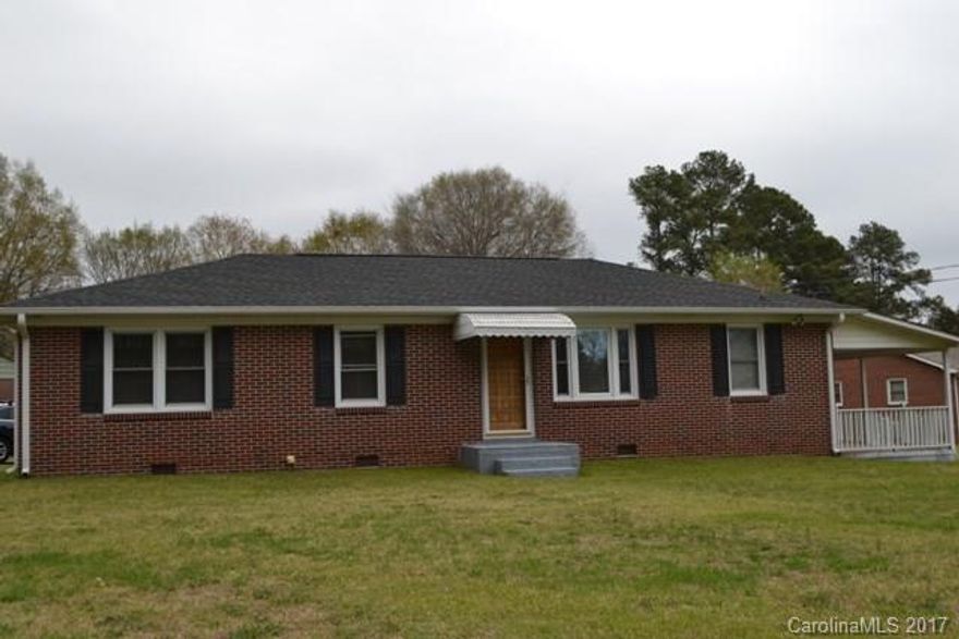 Cute brick home very well maintained on a large corner lot with a beautiful yard.  Pride of ownership shows.  Bonus room opens to a very large covered porch. Newer windows, roof and gutters.  Detached carport enough room for 3 cars.