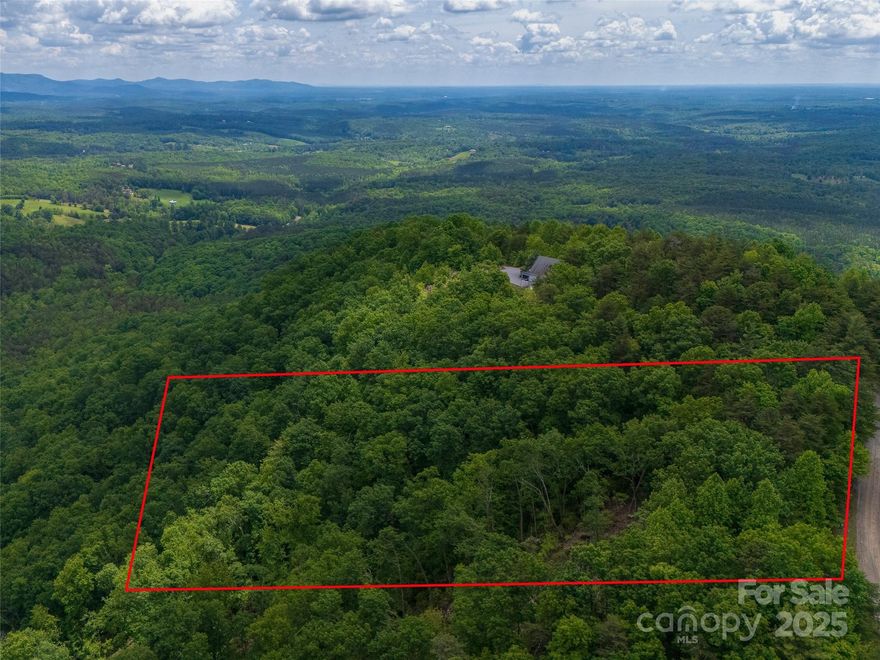 Pinnacle Point, a wilderness development, is a haven of privacy and tranquility, where you can embrace lock and go living. The land lends itself to a multi-tier home with year round spectacular views! On your approach to the lot, look South for a bold view of Lake Lures Chimney Rock, and an  endless vista of the Piedmont. Highspeed internet available. Towns of Marion to N and Rutherfordton to South are 30 minutes away.