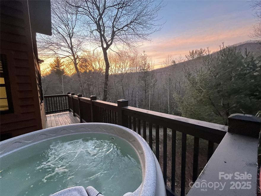 Discover the perfect blend of modern comfort and classic mountain charm in this beautifully updated 2-bedroom, 2-bathroom cabin, ideally located just minutes from the Blue Ridge Parkway. Whether you're searching for a primary home, a peaceful retreat, or a turn-key STR investment property, this inviting cabin captures everything people love about mountain living.

Step inside to a warm, open living space featuring soaring ceiling heights, rich hardwood flooring, and stunning tongue-and-groove ceilings with exposed beams that instantly set the tone for relaxation. Large windows draw in natural light and frame the serene, seasonal mountain views, giving the home a cozy yet expansive feel.

The thoughtfully updated kitchen is perfect for everyday living and entertaining, offering stainless steel appliances, granite countertops, and plenty of cabinet space. The open layout keeps you connected to the living room, making it easy to enjoy time with family and friends.

Both bedrooms offer comfortable retreats, and with two full bathrooms, everyone gets space and privacy. The convenience of in-unit laundry adds to the ease of living whether you’re here full-time or visiting for a weekend escape.

Step outside, and the magic of mountain living continues. Relax in the outdoor hot tub, fire up the grill, or enjoy a meal in the picnic area surrounded by nature. It’s the kind of outdoor space guests rave about and exactly why this cabin performs so well as a vacation rental.

Located in an established vacation rental program, this cabin offers immediate income potential with a strong rental history and a setting travelers love: peaceful and private. With the famed Blue Ridge Parkway just minutes away, guests and owners alike enjoy quick access to hiking, overlooks, and some of the best scenic drives in North Carolina.

Beautifully updated, fully furnished, and perfectly positioned for both personal enjoyment and investment, this mountain cabin delivers it all. The Mountains Are Calling...Are You Listening?