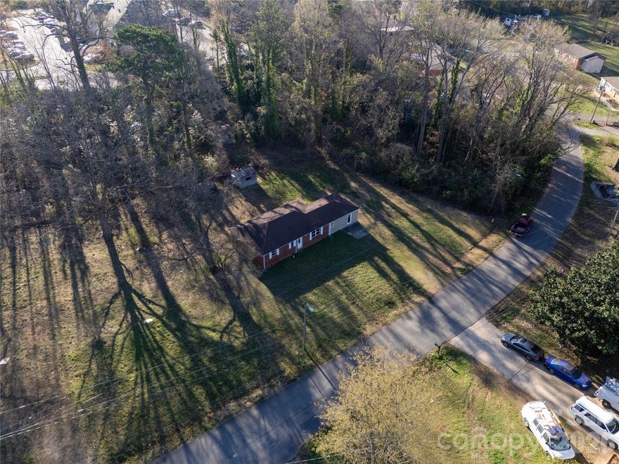 Investors welcome!  Structure on property is considered a tear down. The value is in the lot.  This quiet street is in the middle of university city.  Moments from IKEA, shopping centers, restaurants.  The potential for this lot is tremendous for both residential, multi-family, or commercial investors.  Level, with access to all utilities.  Trees line the back of the property. No HOA.