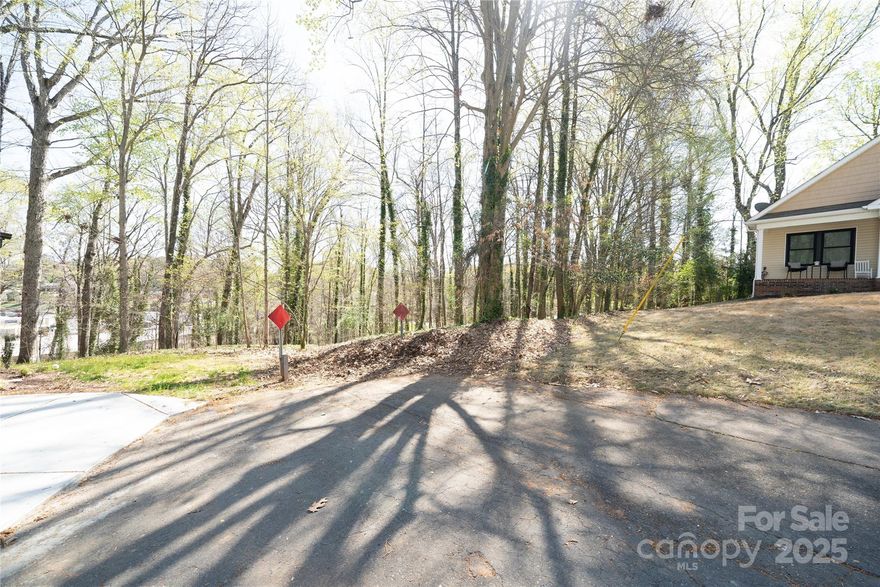 Located in the vibrant, exciting neighborhood of Oakhurst, this .52 acre lot is at the end of a quiet dead-end street. 50 ft road frontage. Water and sewer lines in place. Subdivide or build your dream home. Property to the left of the lot line is owned by the City of Charlotte so no new construction will be added there. New construction is all throughout this community. Convenient to highways and uptown. Walking distance to new shops and restaurants. To use GPS for directions, put in 530 Pierson Dr. 534 Pierson Dr is to the left of 530.
