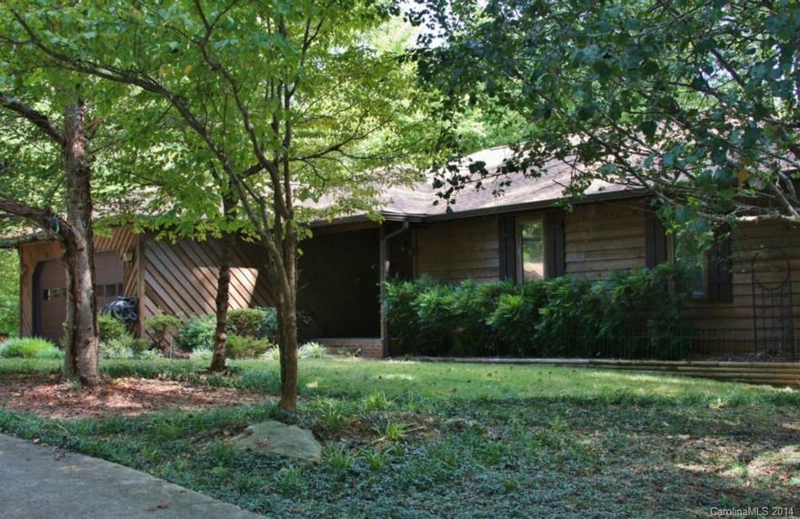 Beautiful private home on 6.81 wooded acres. Enjoy this tranquil setting near McDowell Park Nature Preserve. 3 bedrooms, 2.5 baths.  Septic is permitted for 2 bedrooms.   Lots of nice tile and wood work. Features up to 6 garage bays or workshop space. Updated kitchen with granite countertops. Roof 2 years old. Beautiful yard with garden.  Wildlife and deer roam property. Minutes to Lake Wylie and Rivergate.