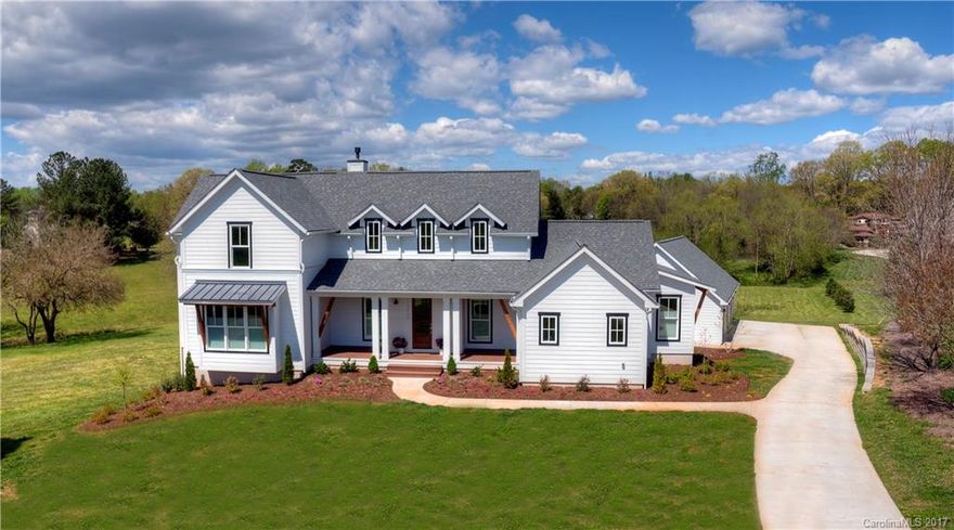 Modern farmhouse living w/exquisite beauty!Unique light fixtures,highend appliances,beautiful tile&granite.Views of pond.Lrge kit. w/ fantastic island,6 burner gas Wolfe cooktop,full size fridge & full size freezer, double convect oven.Gorgeous wood floors.Huge screened porch across back to enjoy view.Mastr w/stand alone garden tub & walkin shower.2 large rec rms as well as exercise rm/2nd office.