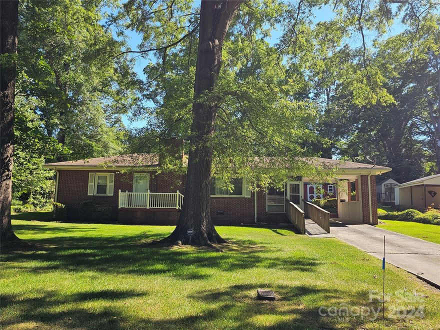 Come and see this lovely older home. Great yard with mature trees, has an outside storage building, single carport, screen side porch. Formal living/ dining room. Den with knotty pine paneling could possibly be a 3rd bedroom by adding a closet.