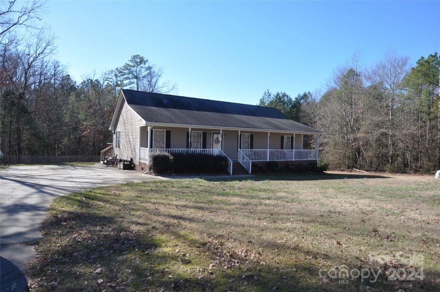 Three bedroom two bath home on 3.5 acres.  Built approx 2005. Kitchen features ceramic tile flooring, solid surface counter tops, all wood cabinets, new built in microwave, range and refrigerator.  Dining area with ltv flooring.  Large living room with coat closet.  Real Oak Crown Molding through out the house.  Master bedroom has ltv flooring as well,  Master bath has double sink vanity and oversized shower.  Most of the attic is floored.  8x14 wired storage building to remain. 30x36 wired garage with two roll up garage doors and separate entrance with concrete flooring and separate driveway. Convenient to Rock Hill and Columbia.  Don't let this beauty get away......