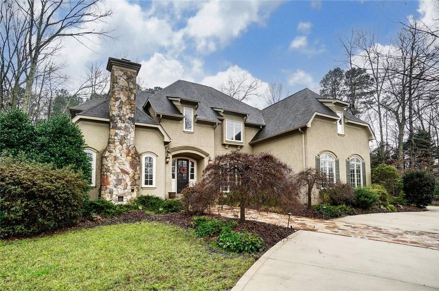 This gorgeous custom home in sought after HIGHGATE will check every box!  Master down with oversized luxury bath and huge walk-in closet. 5" Brazilian Cherry floors throughout main level.  Handsome office w/fireplace, french doors w/seeded glass is perfect for todays work-from-home.  You will enjoy the open concept integrating  kitchen, breakfast area and family room. Views of resort style back yard are breathtaking! Floor to ceiling stacked stone fireplace is flanked by custom built-ins. Serving station/bev. center is ideal for entertaining, and equipped with 2 wine refrigerators. Large adaptable space loft/bonus room with built-ins. Four huge secondary bedrooms, two w/en suite baths all have spacious walk-in closets. Bonus is an amazing movie theater, could be converted to a 6th bedroom if desired. The covered porch with motorized screens overlook the private, fenced back yard. Gorgeous pool with hot tub and waterfall surrounded by beautiful seasonal plantings create a perfect oasis!