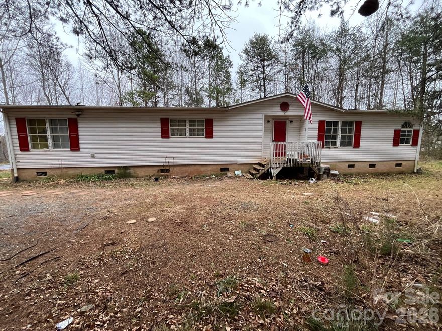 Investor Special! Rare Opportunity! Bring your vision to this spacious doublewide sitting on just over 2 acres of land. Packed with potential, this property is perfect for investors or savvy renovators looking to add value. Enjoy a prime location just minutes from Interstate 40 and Lake James. Sold as-is and cash only—don’t miss this chance to turn opportunity into profit!