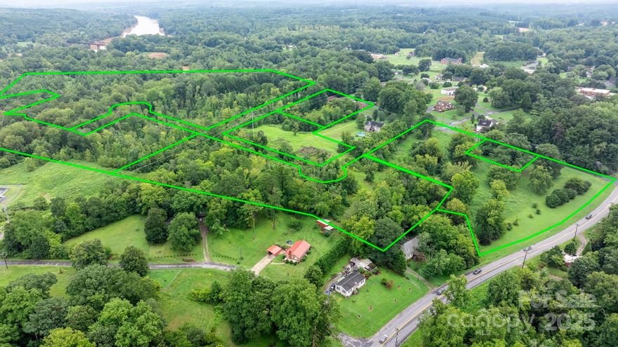 HUGE PRICE IMPROVEMENT!
Seize an exceptional opportunity to acquire 17.87± acres of prime land just a short stroll from Historic Downtown Catawba. Offering approximately 520 feet of highly desirable road frontage with dual access from Main Street and 4th Avenue NE, this remarkable property provides unmatched flexibility and visibility.

Whether your vision includes an upscale residential development or an exclusive private estate, this expansive parcel serves as a blank canvas ready to bring your plans to life. City water and sewer are available, streamlining the development process and enhancing long-term value.

Ideally located with quick access to I-40, the property is just 20 minutes from Hickory and Statesville, while enjoying walkable proximity to downtown dining, shopping, and local charm. For outdoor and lake enthusiasts, Long Island Boat Access on Lake Norman is only 10 minutes away.

Comprising seven individual parcels, this rare offering blends location, scale, infrastructure, and opportunity—a truly distinguished investment.

Act now to secure this premier property before it’s gone.