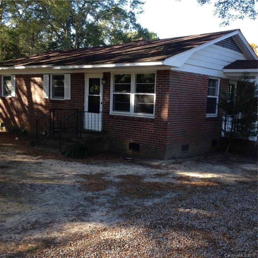 Unbelievable opportunity to be in the heart of downtown Waxhaw. Amazing school district zoned for Waxhaw Elementary. Full brick home with original hardwood floors, updated plumbing and newer bathroom toilet. Large corner lot with fenced yard. Plentiful parking. Home is being sold as-is and has a tenant currently, so no showings allowed until after ratified contract. Current rent is $825 so wonderful opportunity for investors as well as starter home.