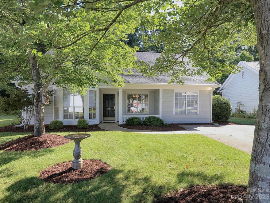 Welcome Home! Adorable, well maintained ranch in Cedarcroft. Freshly painted in a neutral color, laminate hardwood in dining room, great room and primary bedroom. Half wall between the dining room and great room provides definition to both rooms. The kitchen is located off the dining room, and includes a bright breakfast area with a bay window. Laundry is off the kitchen as well. Split floor plan with primary bedroom on one side and secondary bedrooms on other side of house. Primary bathroom with walk-in shower, tile floor and dual sinks.  Generous sized secondary bedrooms. Enjoy your morning coffee on the front porch or the private patio. Patio is spacious enough for a grill, table and chairs for enjoying the outside or entertaining family and friends. Located close to historic downtown Mooresville and all it has to offer. Convenient to I-77, Walmart, Costco, restaurants and shopping. Make your appointment today to see this great property.
