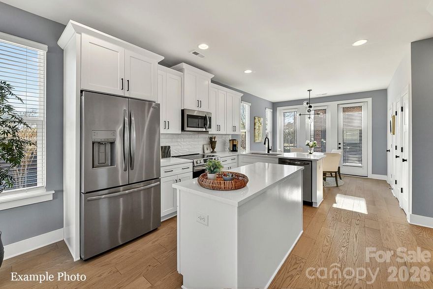 END TOWNHOME UNDER $500,000 JUST OUTSIDE UPTOWN, 3 BLOCKS FROM CAMP NORTH END. SELLER INCENTIVE: Receive up to $13,000 towards closing costs and/or lowering the interest rate! PREMIUM LOCATION, LIVE IN A NEW, BEAUTIFULLY APPOINTED TOWNHOME WITH ROOFTOP TERRACE! Discover Modern Industrial Living at "North End Terraces". A Unique Townhome Community of 69 Homes w/ Modern Design, Artful Architecture & FENCED IN DOG PARK. Nestled between Charlotte's thriving Arts District, NODA, and the bustling Central Business District of Uptown. This home has 3 bedrooms, 2 full and 2 half baths, 2-car attached garage with EV charger and garage door opener. Upscale finishes including LVP floors throughout, plus oak tread staircases. Designer kitchen with white cabinets, quartz countertops, dark gray subway tile backsplash, stainless steel appliances including range, dishwasher & microwave. Primary bath features a large, tiled walk-in-shower with tile wet-bed, modern black fixtures, tiled floors in all full baths and more! This home is not to be missed! INVESTORS:NO RENTAL RESTRICTIONS.