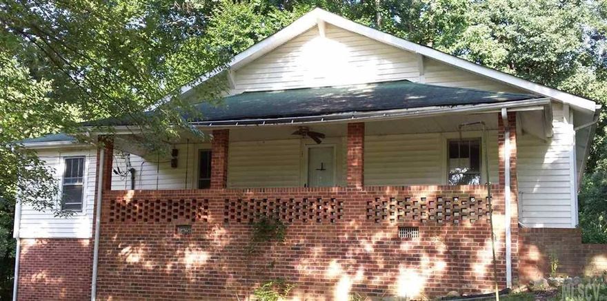 Older home on over 2 acres with spacious rooms and large covered front porch. Hardwood and vinyl flooring throughout home. Home needs some updates and some TLC. Detached 2 car carport with large workshop connected to carport. This is a bank owned property.