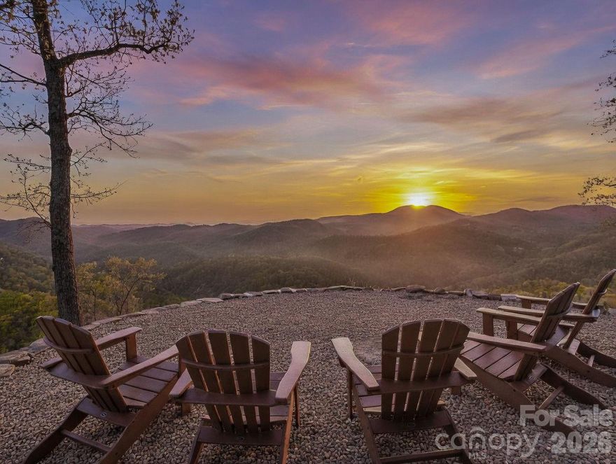 Welcome to 200 Granite Bridge Court, a spectacular mountain retreat on 14 acres between Black Mountain and Lake Lure, NC! This immaculately maintained home sits on top of a knoll and has panoramic mountain views, complete privacy, and usable land around the home! The front porch and gravel fire pit area offer some of the best unobstructed views in Western North Carolina, including views of the Broad River below. This light-filled home features an open floor plan, 2 gas fireplaces (in the living room and the keeping room), a large kitchen, 2 dining areas, a generous mud room off the garage, and the primary suite on the main level. The upper level offers 2 more bedrooms and a full bath, plus unfinished space that could be converted to a bonus room, music or art studio, or more! Even with these areas finished, there is tons of storage both in the attic and the crawl space (with concrete slab). Lake Lure is just minutes away, and Downtown Black is only a 30 minute drive. If you're looking for a secluded getaway within minutes to hiking, fishing, mountain biking, shopping, and dining, be sure to tour this incredible home! New HVAC in 2021. New appliances in the last 5 years. Spectrum cable high-speed internet. Granite Bridge Court is a well-maintained gravel drive, but 4WD/AWD is needed to avoid damage to the driveway. Driveway is gated - no drive-by's! Please call agent to show (proof of funds or pre-qualification letter required for showings). Most furnishings can convey.