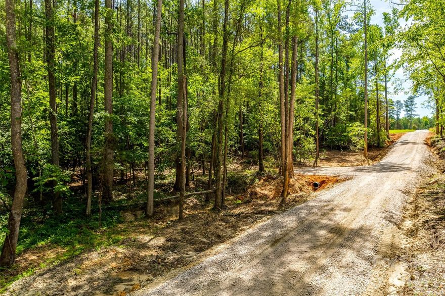 Great opportunity to build your dream home on 8.68 acres! This 8.68 acre tract of raw land offers an incredible
opportunity for anyone looking to build their dream home in a peaceful, private setting. Bring your own builder or use one of our preferred builders, with no HOA and few restrictions to contend with, you can truly create a home that meets your needs. The property is located a short drive from both I-85 and Hwy 5 bypass making it a convenient location for commuters. 30 ft. private easement to access the property
