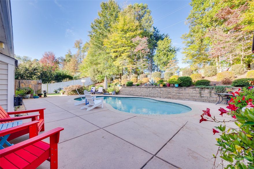 Welcome to your dream home on nearly half an acre in Matthews! This well-maintained home boasts tons of upgrades. Private fenced outdoor oasis with a spacious in-ground saltwater pool, cozy firepit area, and cedar-covered pergola with a metal roof for all-weather enjoyment. Recent improvements include a new A/C unit (2023), storm doors both front and back, updated smoke detectors, chic bathroom fixtures, and decorative stone walls surrounding the home. Gutterguard installed in 2019 and the roof carries a generous 50-year warranty.
Spacious kitchen with granite countertops, stainless steel appliances and breakfast bar. Upstairs, there's a large bonus space complete with a dry bar and beverage fridge, ideal for unwinding or hosting friends. The primary suite on the main floor features a custom closet system, and remodeled bathroom. Walkable distance to scenic Colonel Beatty Park. Conveniently located to Charlotte, this gem won't be on the market for long. Schedule a showing today!
