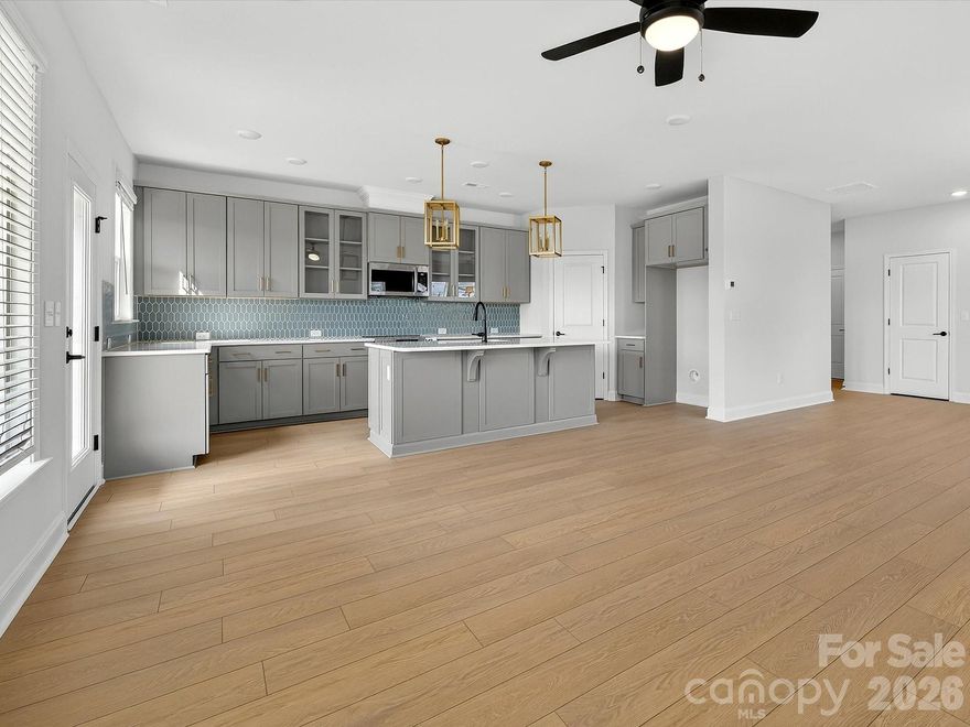 Experience refined townhome living in the Bushwick II, the stunning model home plan at Westview Towns-perfectly located just minutes from the boutique shops, dining, and timeless charm of historic Downtown Waxhaw.

This beautifully designed end-unit townhome blends light-filled living spaces, elegant finishes, and the comfort of a private backyard oasis. Expansive windows overlook the serene outdoor space, filling the open-concept layout with warmth and style-ideal for both relaxed living and effortless entertaining.

Upstairs, the Owner's Suite serves as a tranquil retreat, complete with a spacious sitting room-perfect for reading, relaxing, or enjoying your morning coffee.

Additional highlights include an oversized two-car garage for ample storage and flexibility. As an end unit, you'll enjoy enhanced privacy, extra windows, and a naturally bright, open feel that elevates everyday living.