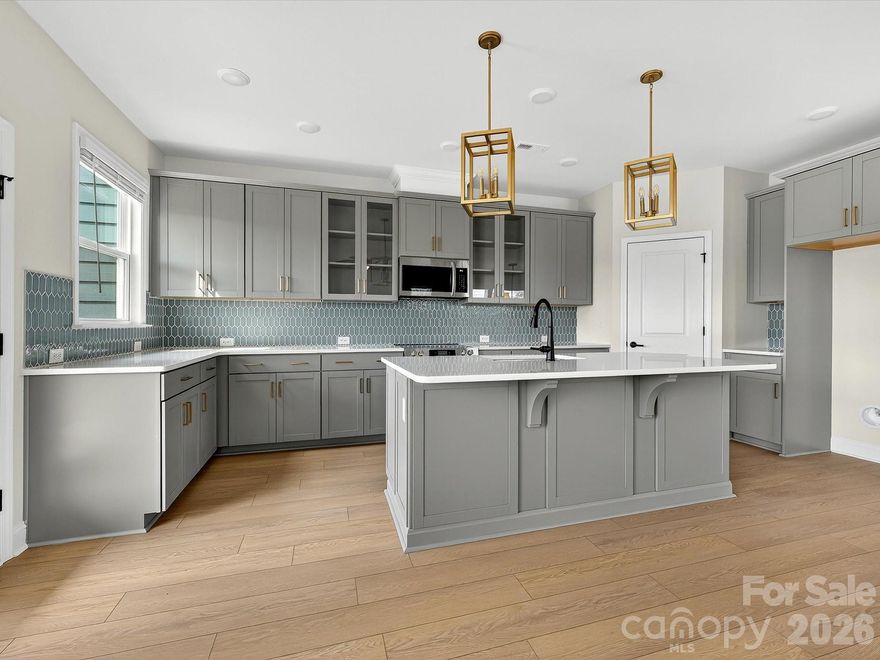 Experience refined townhome living in the Bushwick II, the stunning model home plan at Westview Towns-perfectly located just minutes from the boutique shops, dining, and timeless charm of historic Downtown Waxhaw.

This beautifully designed end-unit townhome blends light-filled living spaces, elegant finishes, and the comfort of a private backyard oasis. Expansive windows overlook the serene outdoor space, filling the open-concept layout with warmth and style-ideal for both relaxed living and effortless entertaining.

Upstairs, the Owner's Suite serves as a tranquil retreat, complete with a spacious sitting room-perfect for reading, relaxing, or enjoying your morning coffee.

Additional highlights include an oversized two-car garage for ample storage and flexibility. As an end unit, you'll enjoy enhanced privacy, extra windows, and a naturally bright, open feel that elevates everyday living.