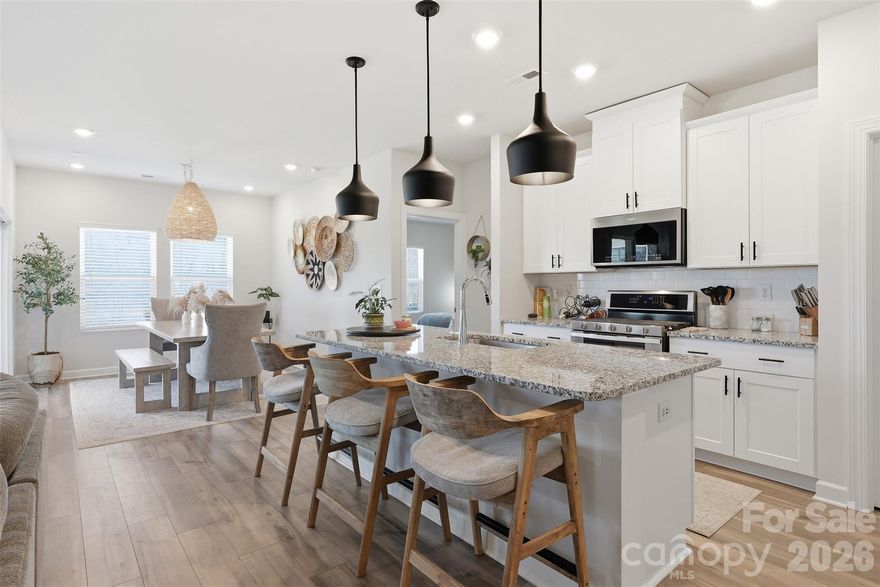 Professionally decorated and thoughtfully designed, this beautiful 3 bedroom/2 bath ranch is nestled within the highly sought-after and amenity-rich Solena at The Vineyards community. The open-concept floor plan is centered around a true chef’s kitchen featuring linen cabinetry, a large center island, granite countertops and stainless steel appliances, ideal for both everyday living and effortless entertaining. The kitchen flows seamlessly into the dining area and inviting living room, with direct access to a covered rear porch overlooking the fully fenced backyard.

The primary suite offers a peaceful retreat, complete with a spa-inspired en-suite showcasing a spacious stand-alone shower, dual-sink vanity and a custom walk-in closet. Two generously sized secondary bedrooms share a well-appointed full bath, providing comfort and flexibility. Residents enjoy access to exceptional community amenities, including a resort-style pool, fitness center, tennis courts, playground, walking trails and scenic waterfront living along Lake Wylie!