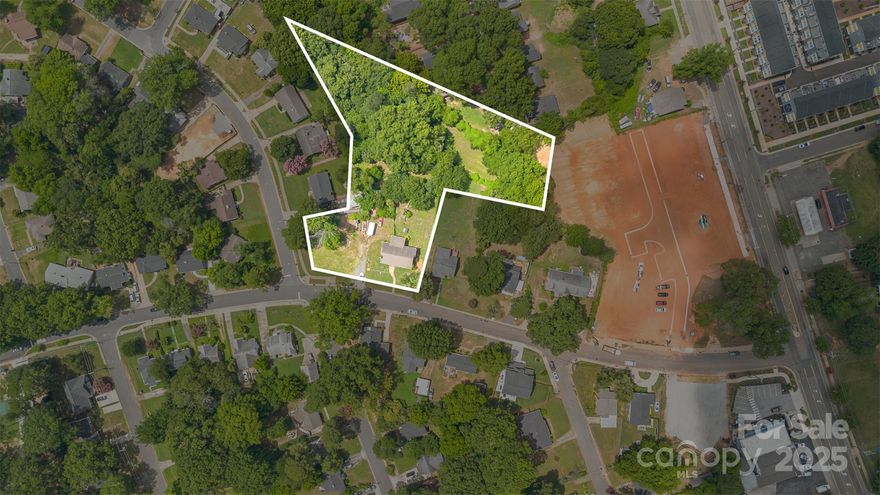 Incredible redevelopment opportunity in the booming Enderly Park neighborhood. This prominent corner parcel spans approximately 1.25 acres and is zoned N1-C, allowing for a range of residential options including single-family homes, duplexes, and triplexes. The property offers multiple possibilities for end users, builders, or investors — purchase the full parcel for a larger project or explore the potential to divide the property for smaller residential builds, subject to buyer due diligence and approvals.

Located in a designated Opportunity Zone, this site is well positioned for long-term growth and redevelopment. Just minutes from Uptown, Bank of America Stadium, I-85, and Charlotte Douglas International Airport. Only one block from Enderly Park with pickleball, tennis, and basketball courts, plus open green space. Walkable to local shops, Marquee Charlotte, and nearby amenities.

Surrounded by ongoing development and new construction communities such as The Enclave at Enderly Park, the area continues to see strong demand and appreciation. Existing home is being sold as-is (fair condition per seller). Lots have been combined — see attached survey. Strong comps, active development, and flexible potential make this a prime infill opportunity in one of Charlotte’s most dynamic neighborhoods.
