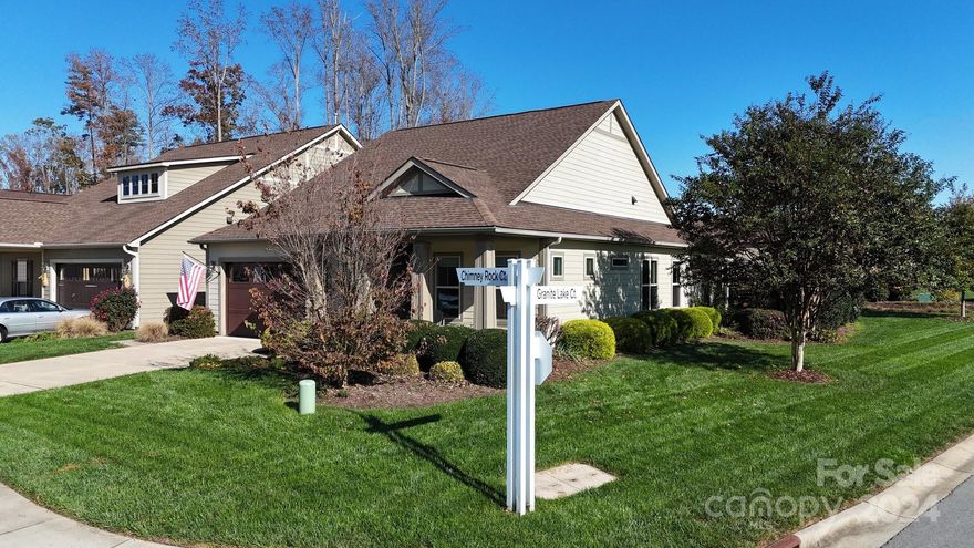 ***HOME CANT BE BUILT AT CURRENT PRICE***  Why wait when you can stroll to The Twin Mills Club. Well-appointed kitchen anchors the main living area. SS gas cook top, wall oven, granite countertops & tile backsplash. Custom cabinetry & bookshelves in flex/office space. Wall of glass opens to the Tennessee Fieldstone paved extended Lanai w/ privacy shades, gas firepit & grilling area extending outdoor entertaining options. Private fenced back yard w/mature landscaping, accent lighting & access to miles of walking trails. Great room features gas FP & built in surround sound speakers. Serene master suite w/custom window seat adding storage & ensuite bath w/dual sink vanity, generous walk-in closet and tiled shower. LVP & tile floors throughout the main living areas (new carpet in primary bedroom) 10' ceilings & 8' doors . 2 car garage w/4' extension & extensive hanging storage rack system. Trilogy Membership includes Freedom Boat Club on Lake Norman plus award winning amenities
