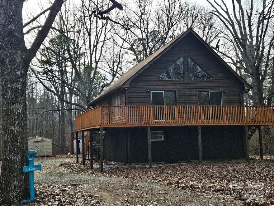 Looking for a quaint cabin in the woods? Look no more. This cozy cabin sits on 1.03 acres of wooded land. Close to I 85, so easy commute north or south. Unfinished lower level includes a pool table that will remain. This level is not heated but a great space for a man cave or play area. HVAC installed late 2023. Wrap around deck for enjoying nature. Priced below tax value. This special property is waiting for you!