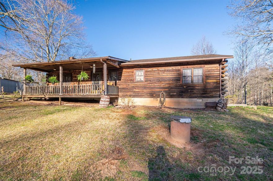 This is an amazing log cabin home set on 5.73 acres. Plenty of room to build still on this land if you wanted, as zoning does permit. Creek at the back of the property at the bottom of slope. If it's an oasis of privacy and tranquility that you are in search of, look no further. COZY is the best way to describe this log cabin. There's also a basement with tons of potential for a workshop, or just storage as needed. As the saying goes, they aren't making any more land, so a home with just under 6 acres is a great grab right now. Garages have electricity.  Come tour this home today, there's no telling how long this will last.