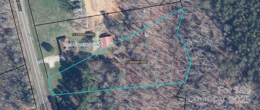 This approx. 1.91 acres has approx. 60 ft. frontage on Blacksburg Highway less than 1/2 mile N of I85.
It adjoins 1378 Blacksburg Hwy on N side.  The two can be bought together.  1378 Blacksburg Highway is Canopy MLS # 4255602.
Open at front with with woods on rear, and borders small creek in rear.
There is no zoning in rural Cherokee  county, so use is what will work for buyer and meet Cherokee county codes other than zoning. However, sellers reserve the right to approve what type development to protect house value.
City water is available but purchaser would need to get tap.
Area has mixed uses, but is predominantly at this are and N residential. There are commercial uses closer to I85 as you move to the South.