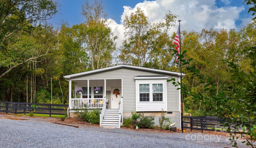 Looking for the privacy of a rural lifestyle without the long commute?  This home situated on .63 acres offers the ultimate blend of peaceful country living while keeping you just minutes from essential grocery stores, premier shopping, and local dining.  Step inside to find a modern, open-concept layout elevated by 9 foot ceilings and sleek drywall finishes.  The heart of this home is a gourmet kitchen featuring a large island perfect for winter entertaining.  Retreat to the expansive primary suite, complete with a luxury walk-in shower.  This home is definitely designed for comfort.  Outside, the fenced yard features a dedicated fire pit area for starlit winter nights.  In addition, the yard includes a specialized dog run to keep paws clean during the wet winter months.  With ample parking for six or more cars, hosting gatherings is effortless.  Don't miss this opportunity to enjoy rural tranquility without sacrificing city convenience.