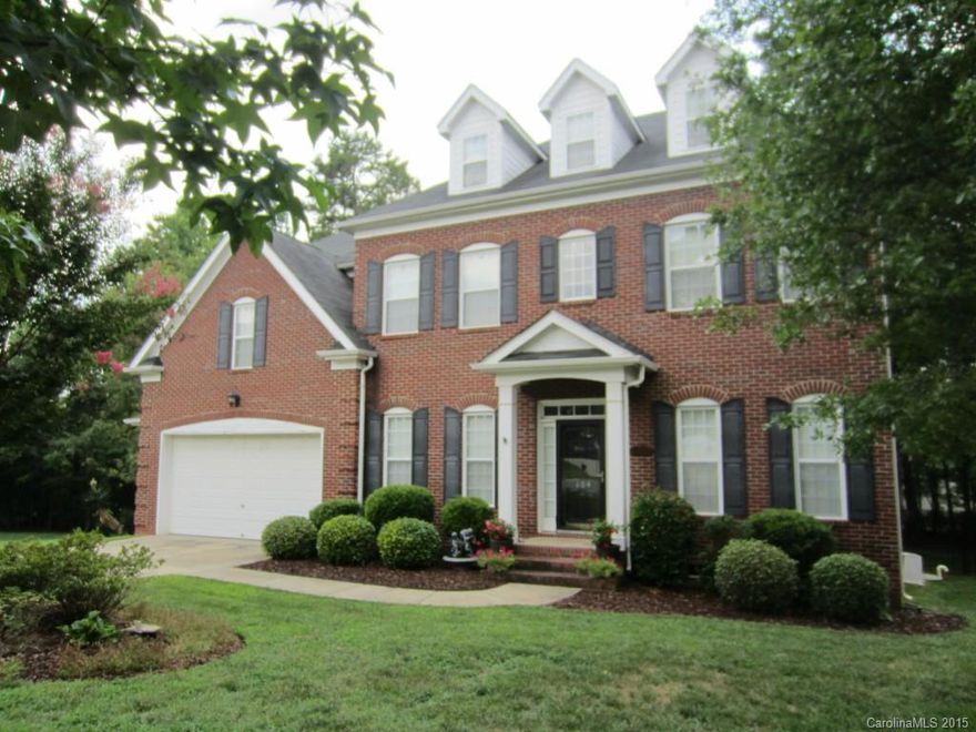 Beautiful brick home on a cul-de-sac. Formal dinning, living room, office, bedroom suite on main level. Large kitchen with cherry cabinets, corian counters, and a breakfast nook.  The family room features built ins with a gas fireplace. Main level is bright and open with hard rock maple flooring throughout. Duel staircases up to second level. A large Master suite with spa like bath. 2 bonus rooms, 1 can be used as an additional BD. Large deck overlooking fenced backyard. Many upgrades. Must see.