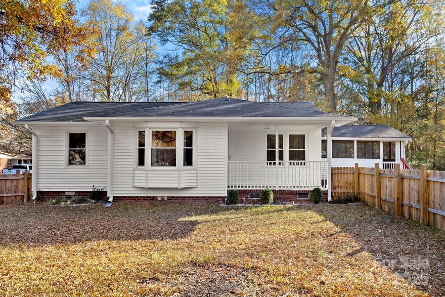 Don’t miss this adorable 2-bedroom, 1-bath home—updated and move-in ready! Enjoy LVP flooring throughout, fresh paint, spacious bedrooms, and a large eat-in kitchen. The screened-in porch overlooks a fenced yard with mature trees, perfect for relaxing or entertaining. Major updates include a new HVAC system, hot water tank, and bathroom vanity (2021), plus a new roof in 2020. Situated on a charming corner lot with no HOA fees, this home offers comfort, privacy, and convenience.  Home is being sold AS-IS.