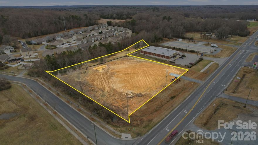 2.6-acre commercial lot in Monroe, NC, zoned NB. Located next to Dollar General and across from Circle K. High visibility, recently graded and ready for development. Ideal for retail, office, or service use.