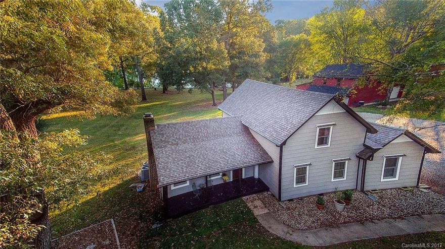 Saddle up your horses and ride out to this one! Great horse/llama farm with a 2 stall barn and room for a 3rd. Home sits on a large 15+acre  pond about 15ft deep with dock, boat conveys and plenty of fish.Upgraded kitchen, baths, bedrooms, pristine palet to decorate. Barn offers great space for workshop/auto shop. Fully finished apartment with bath over the barn. NO HOAs, 10 minutes from the Buster Boyd Bridge to CLT, 25 minutes from airport, LOW SC taxes, and award winning Clover schools.