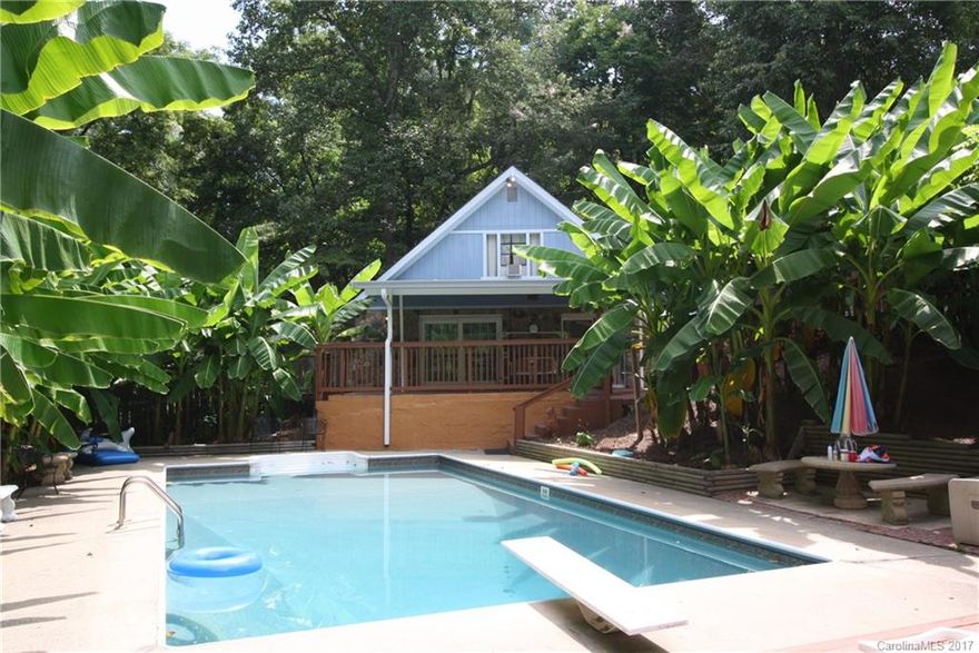 Welcome to PARIDISE! Three bedroom two bath one of a kind A-frame in a extremely quiet and private setting. Covered back porch overlooks 18x36 pool and pool house with a bathroom. Pool is lined with banana trees, making this property a private oasis. Great pool views from the master bedroom and living room. Huge lot with a detached garage/workshop. New owner will be able to live the laid back, vacation lifestyle EVERYDAY!