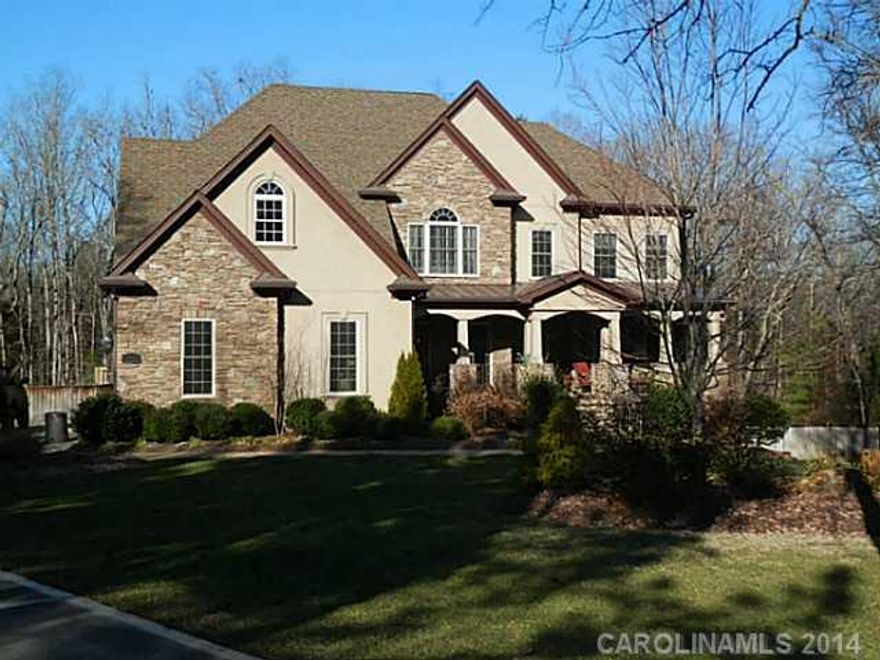 Custom home on 1.32 acres bordering neighborhood green space. Upscale details throughout.  Hardwoods in every room e/c bonus. Panoramic windows.  Open plan offers spaces to accommodate every need. Foyer opens to formal DR & library. GR w/fireplace & gorgeous kitchen for discriminating cook. A bedroom and guest bath is on the main. Master has private den, luxury bath. GEOTHERMAL HVAC.