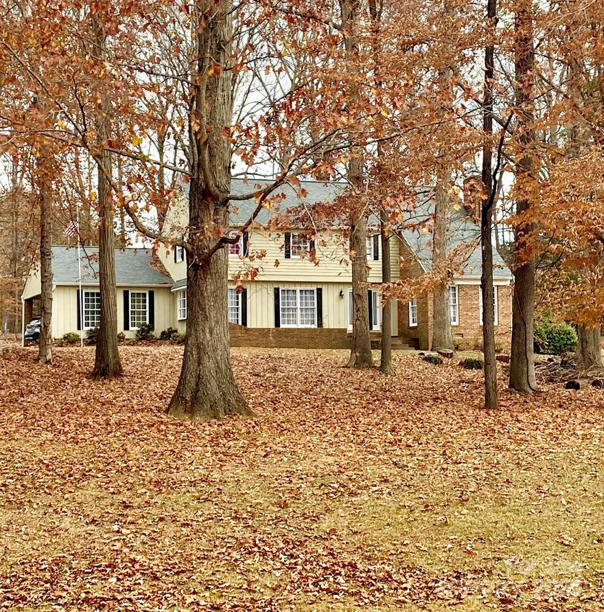 ***PRICE REDUCTION $20,000***Over 1.19 Acres. Large wooded estate sized homesite . NO HOA! in much sought after Farmwood***  This home renovated and new roof in 2021 all baths renovated at that time, beautiful custom tile shower in owners suite, HVAC (AC) on one unit replaced in 2024. However, seller offering a 1.5% concession towards upgrades or closing costs. 2 car carport attached, front patio, and rear deck looking out over large estate sized lot with mature trees. Close to downtown Mint Hill and small town feel but so close to all shopping, restaurants, professional sports venues and all that uptown has to offer. Convenient to Charlotte Douglas International Airport. Make an appointment to see today. ***Note pictures were taken prior to seller move in.***
