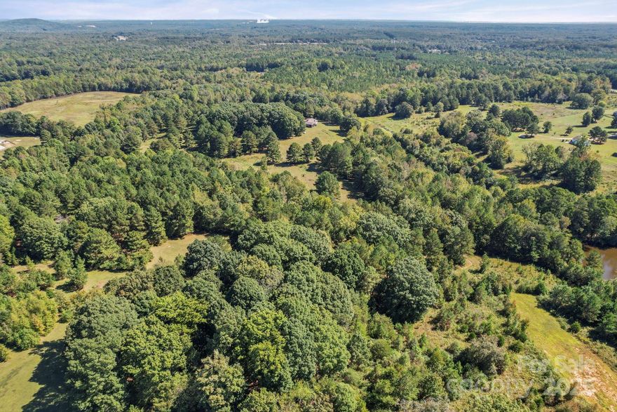 Discover the perfect blend of convenience and countryside charm with this 21.01-acre parcel, zoned as farmland and ideally situated just off Charlotte Highway. Offering wide open space and endless possibilities, this property provides the tranquility of rural living while being only a short drive to Lake Wylie and the vibrant city of Charlotte. Whether you’re looking to establish a working farm, create a private homestead, or invest in future opportunities, this land delivers flexibility and potential. Enjoy the added benefit of low county taxes, making it a smart and affordable choice.