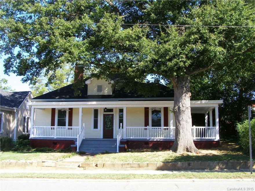 Classic Southern Charm w/all the updates you're looking for! NEW AC, water heater, roof, vinyl siding,trim,shutters, windows,front & back doors, porch columns & rails. NEW vapor barrier in crawl + insulation all exterior walls. NEW HWs in back BR,hall, Kitchen & mud, + refinished HWs throughout remaining. NEW tile in baths & laundry. Kitchen has NEW cabinets, ss steel stove, microwave & dishwasher. Crown molding, fresh paint throughout, the list goes on.  All within walking distance to downtown!