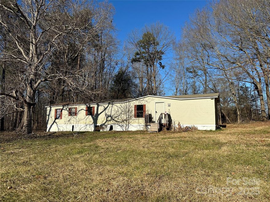 Single wide 2 bedroom, 1 bathroom mobile home on nearly one acre lot. Needs some work. New front and rear doors. New well pump in 2023. Newer flooring. Good bones. Low county taxes. Minutes to downtown Clover and York. Price adjusted for its condition. No lease to own. No owner financing.
