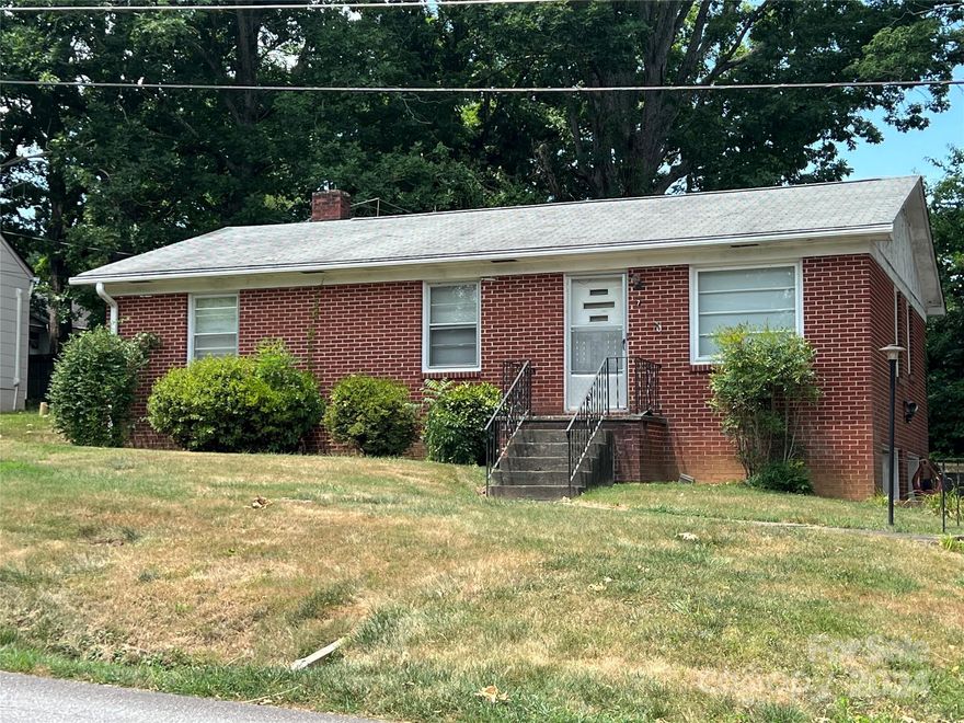 INVESTOR ALERT! This home is being sold AS-IS in its current condition. Home has mold & needs someone willing to do mold remediation. Seller has not personally lived in the home but believes the exterior stairwell drain doesn't drain which led to the water issue leading to a rotted door in the basement, creating the mold. Kitchen & baths need updating. The fully unfinished basement has a full bath and two car garage making it ideal for gaining additional bonus space.  Termite damage suspected. Retaining wall needs to be repaired. Enjoy the daily bell chimes of the VA Hospital at 8:30am, noon, 3:30pm. Because seller has not lived in the home this will be a special warranty deed. 7 Browndale Road is begging for someone to bring their creativity and personal touches!  Imagine stepping out the front door of your newly remodeled home for a walk in this tranquil neighborhood. Home is located in East Asheville very close to the VA Hospital, shopping, restaurants.