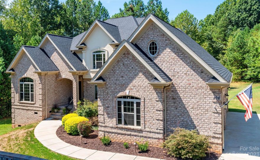 Welcome Home! This elegant custom built, all-brick home will WOW you at every turn. From the glass and iron double front doors, to the soaring foyer with gorgous staircase, to the stunning coffered ceiling designs in several rooms, to the marble tiles on the kitchen floor, to the bamboo wood floors, and so much more. High end commercial grade appliances in the chef's kitchen. Dual fuel stove. Massive wall of windows and fireplace in great room. You'll love the private office in the front and the keeping room with fireplace off the kitchen. Primary suite on main level features stunning ceiling, a beautiful bathroom, and large closet. Pick which one of the dual staircases you'd like to venture upstairs where you'll find 3 more bedrooms, 3 full bathrooms, and a large loft. Backyard features a gorgeous deck, an oversized paved patio, and is surrounded by an adundance of beautiful trees for privacy. Water softener system. Tankless water heater. Hot tub to convey.Dual fuel 1st floor furnace.